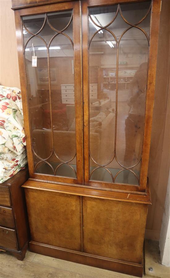 A Georgian style walnut bookcase H.214cm